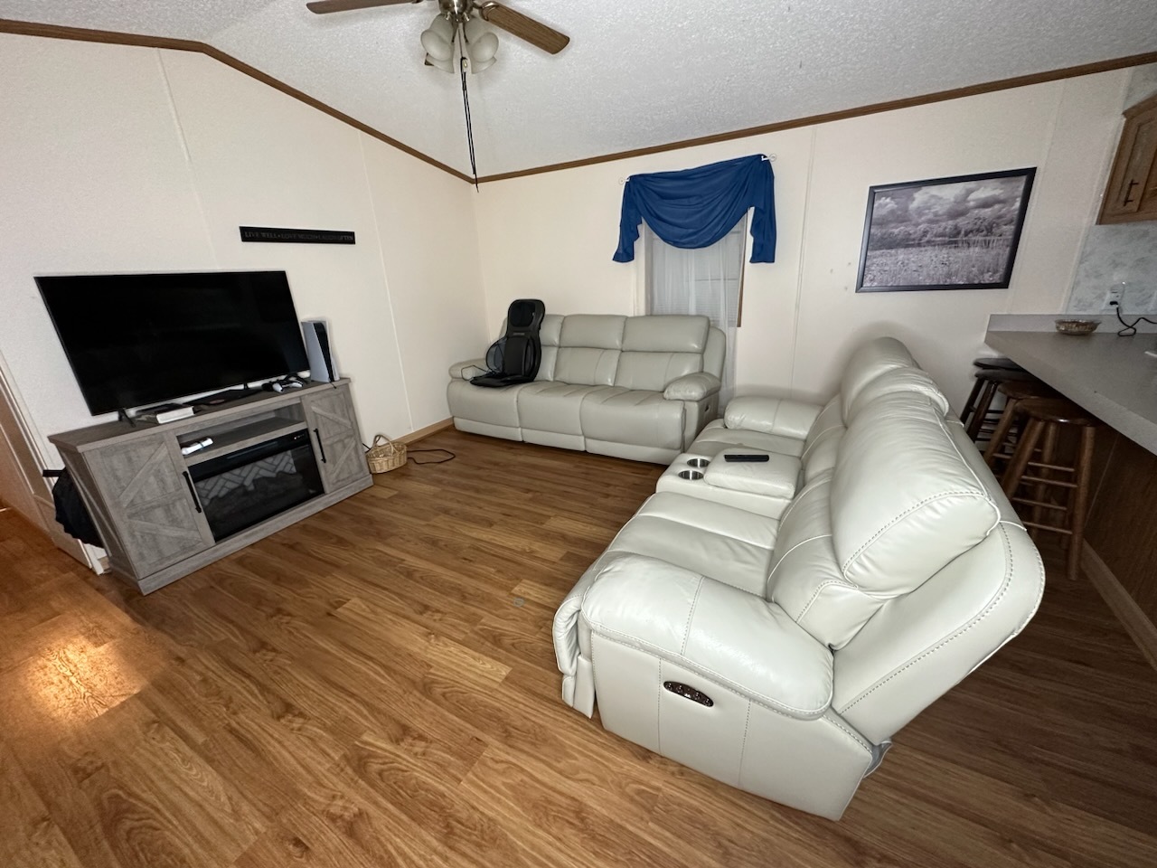 8800 South Harlem Avenue, Unit 809 Bridgeview, IL 60455 - Photo 5 of 14 a living room with furniture and a flat screen tv