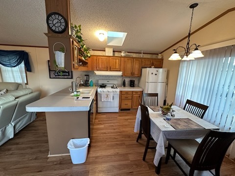 8800 South Harlem Avenue, Unit 809 Bridgeview, IL 60455 - Photo 6 of 14 a open kitchen with a table chairs and a stove