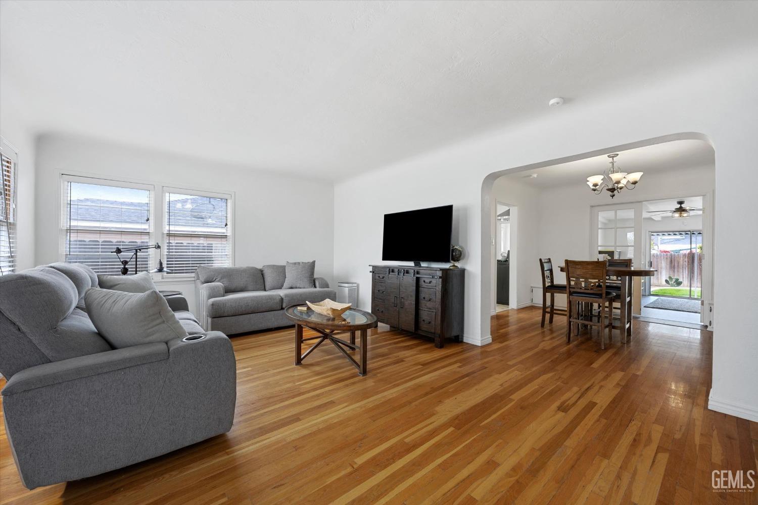 Undisclosed Address Bakersfield, CA 93305 - Photo 12 of 46 a living room with furniture and a flat screen tv