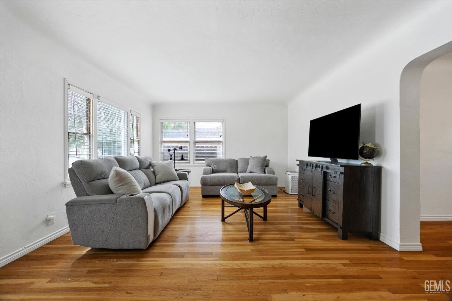 Undisclosed Address Bakersfield, CA 93305 - Photo 14 of 46 a living room with furniture and a flat screen tv