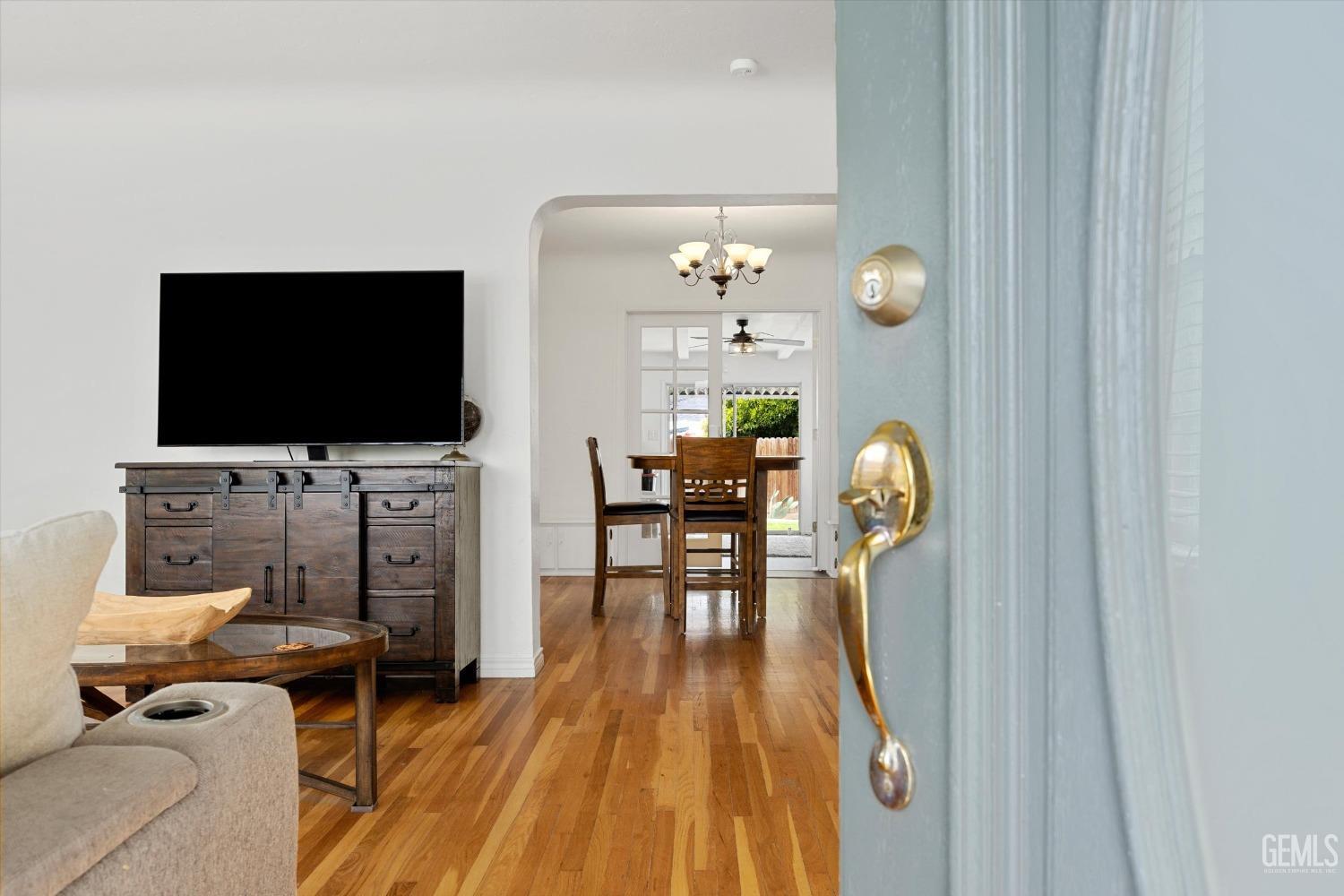 Undisclosed Address Bakersfield, CA 93305 - Photo 16 of 46 a living room with furniture and a flat screen tv