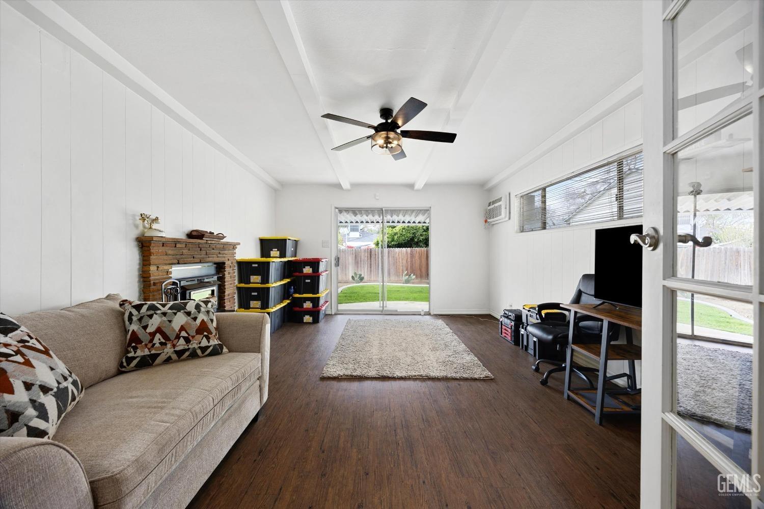 Undisclosed Address Bakersfield, CA 93305 - Photo 19 of 46 a living room with furniture and a flat screen tv
