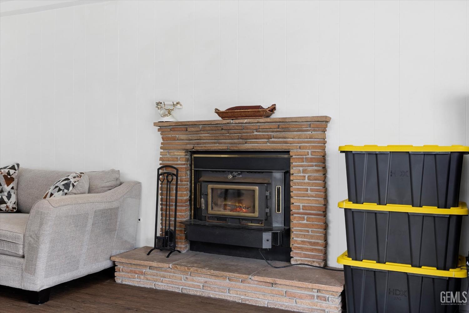 Undisclosed Address Bakersfield, CA 93305 - Photo 20 of 46 a living room with furniture and a fireplace