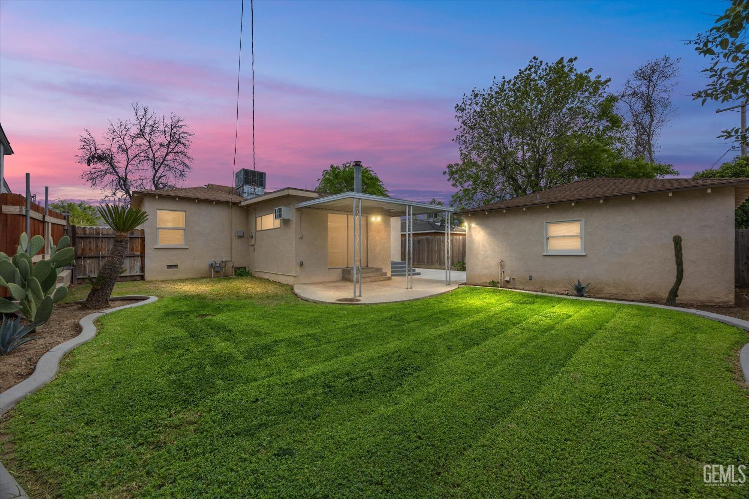 Undisclosed Address Bakersfield, CA 93305 - Photo 2 of 46 a front view of a house with garden
