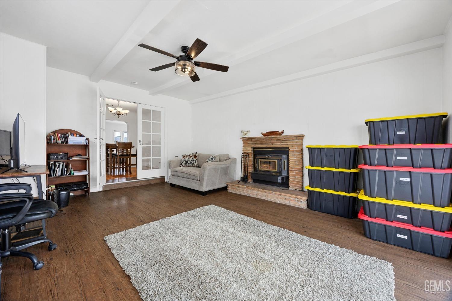 Undisclosed Address Bakersfield, CA 93305 - Photo 21 of 46 a living room with furniture and a fireplace