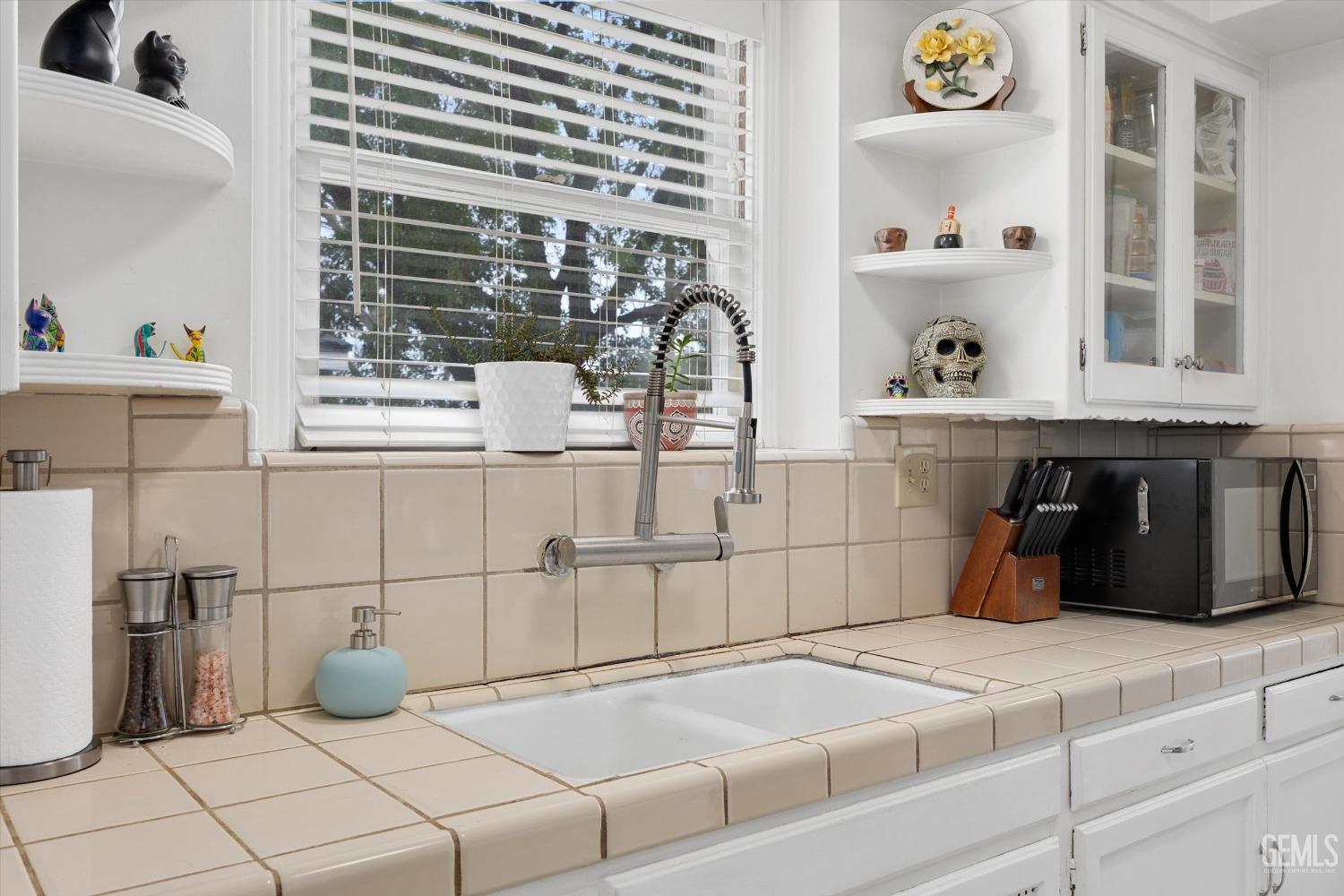 Undisclosed Address Bakersfield, CA 93305 - Photo 25 of 46 a bedroom with a bed and a window