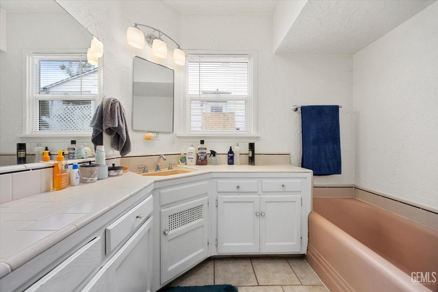 Undisclosed Address Bakersfield, CA 93305 - Photo 30 of 46 a kitchen with white cabinets and sink