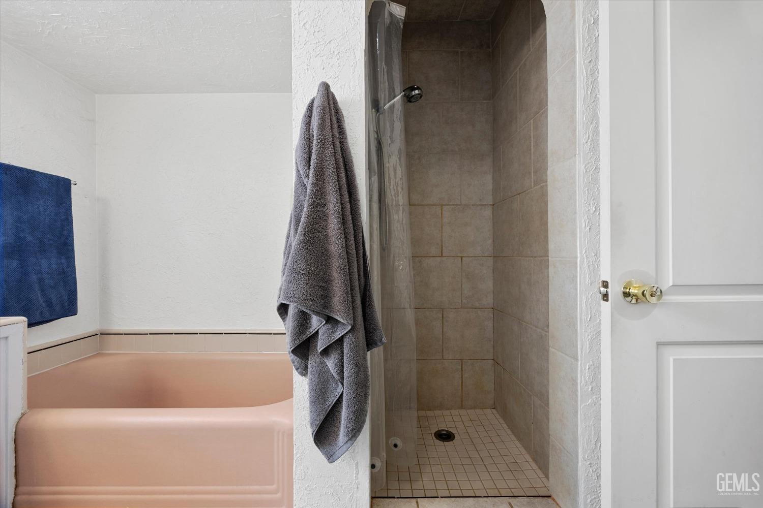 Undisclosed Address Bakersfield, CA 93305 - Photo 31 of 46 a bathroom with a tub and a shower