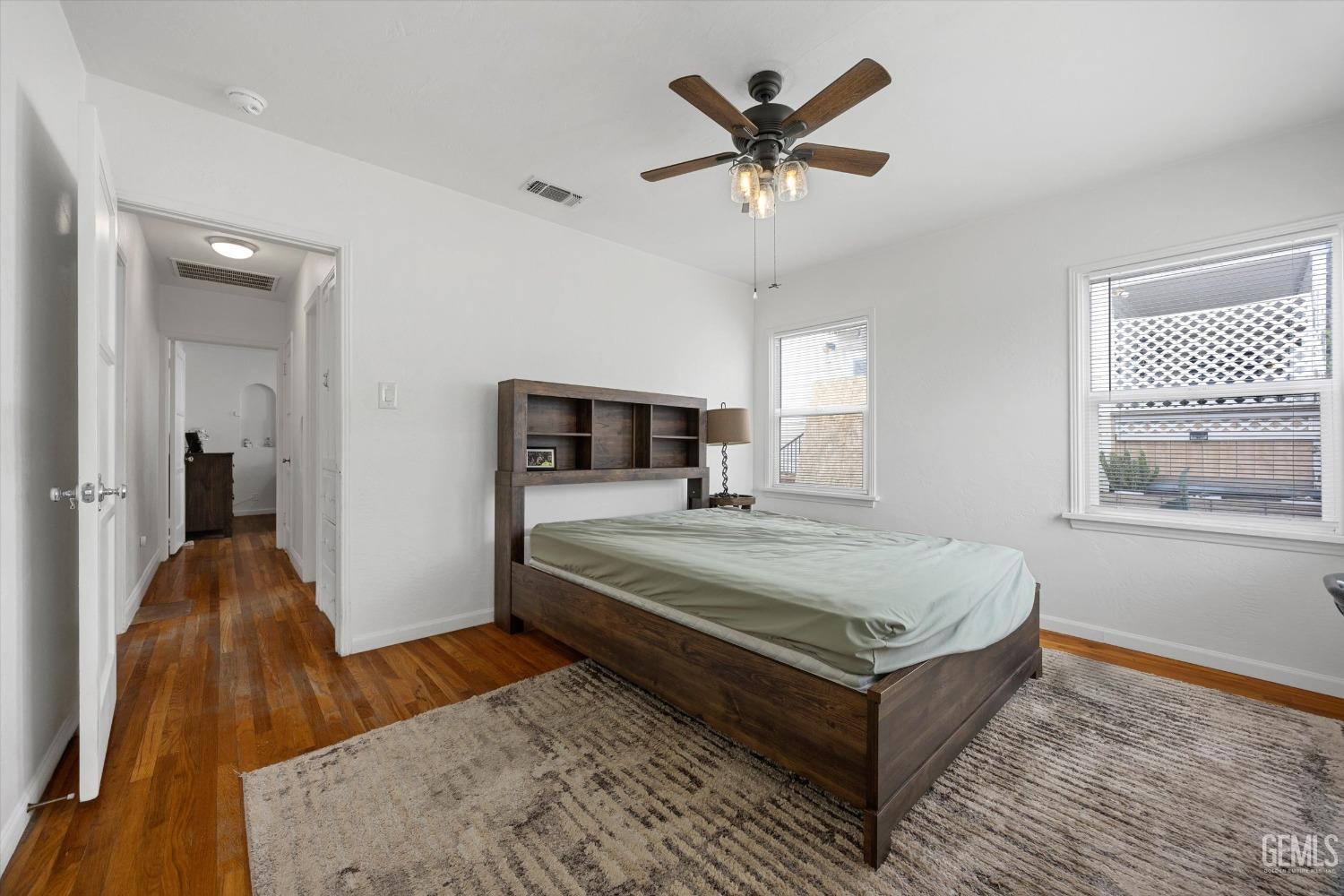 Undisclosed Address Bakersfield, CA 93305 - Photo 33 of 46 a spacious bedroom with a bed a dresser and a window