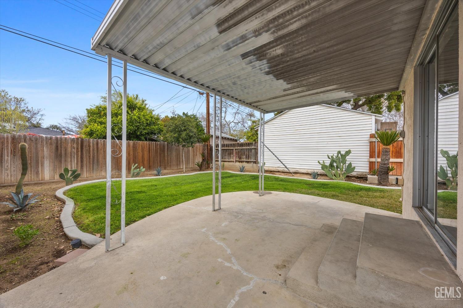 Undisclosed Address Bakersfield, CA 93305 - Photo 36 of 46 a view of a backyard with wooden fence
