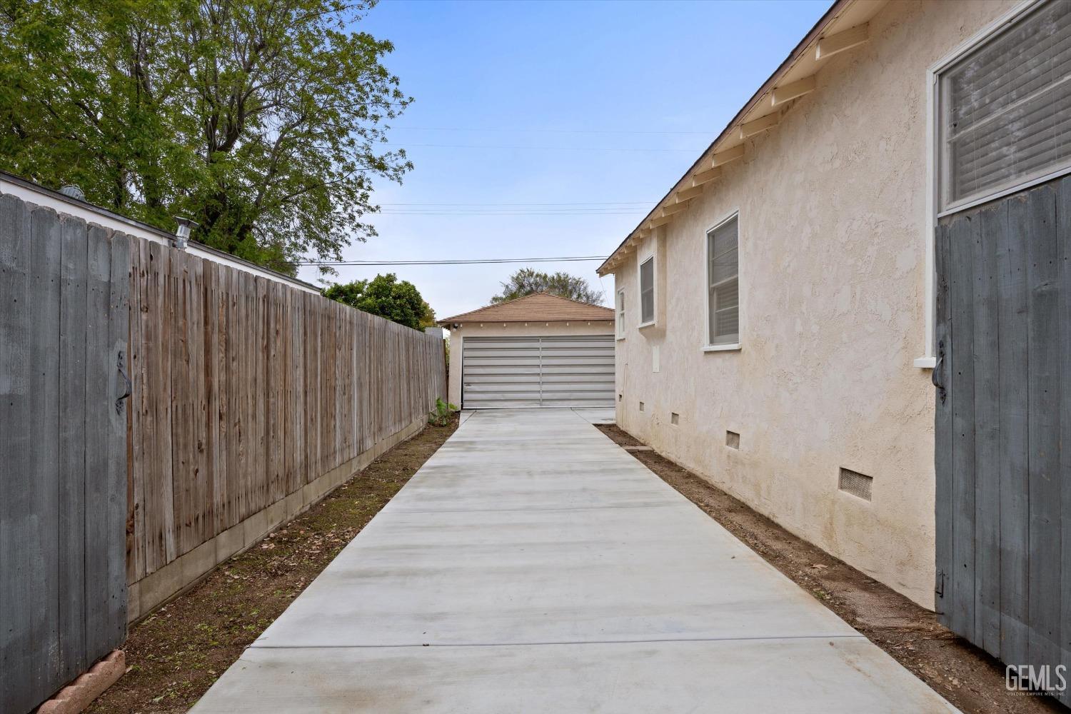 Undisclosed Address Bakersfield, CA 93305 - Photo 39 of 46 a view of a house with a wooden fence