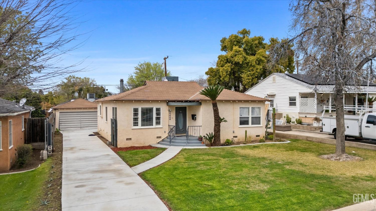 Undisclosed Address Bakersfield, CA 93305 - Photo 4 of 46 a front view of a house with garden