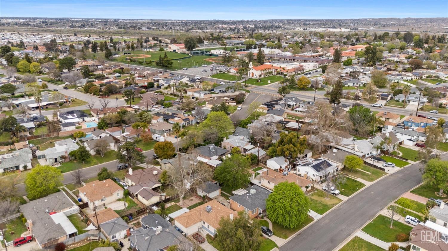 Undisclosed Address Bakersfield, CA 93305 - Photo 8 of 46 an aerial view of residential houses with outdoor space