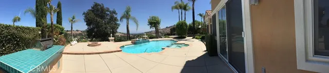 a view of a swimming pool with a patio