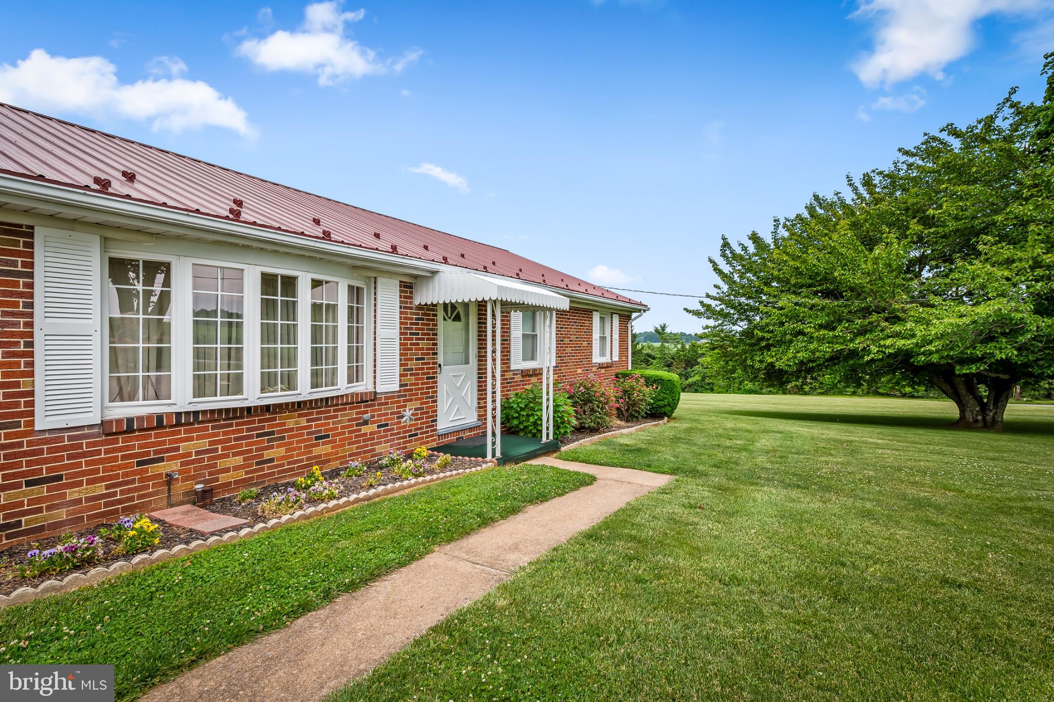 2100 Peterman Road Freeland, MD 21053 - Photo 5 of 36 Charming brick home with lush greenery.