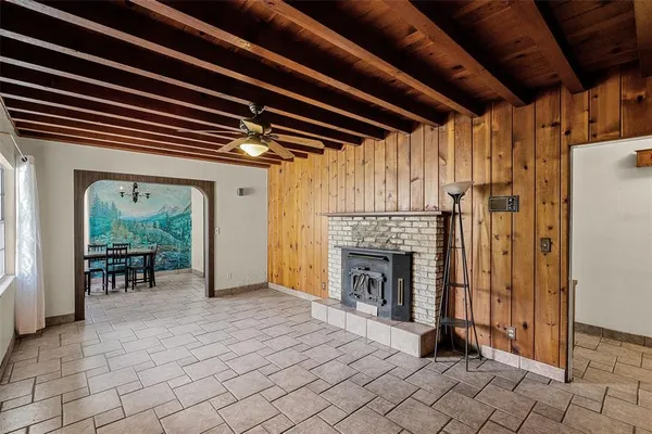 a view of a livingroom with a ceiling fan and window