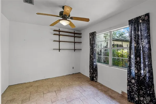 a room with cabinet and windows