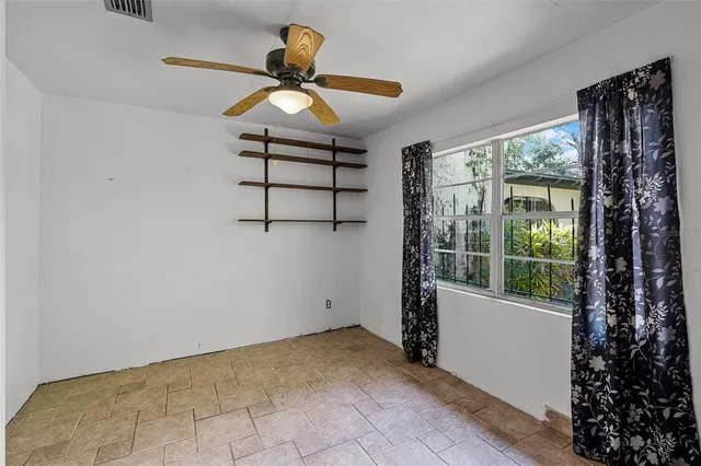 a room with cabinet and windows