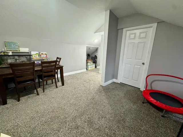 a bedroom with bed and window
