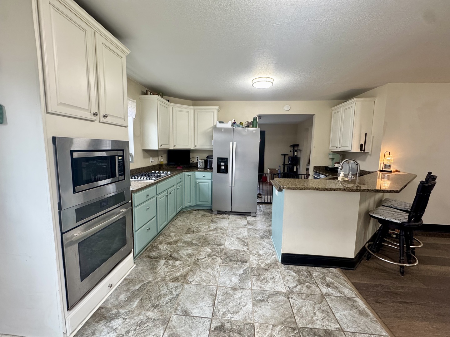 402 North Center Street Colfax, IL 61728 - Photo 5 of 25 a kitchen with refrigerator cabinets and furniture
