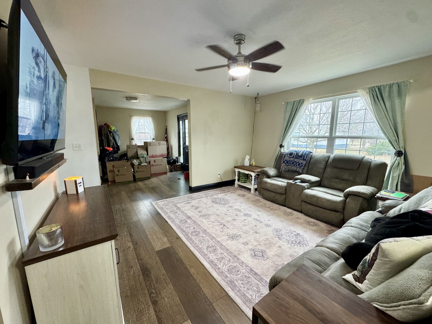 402 North Center Street Colfax, IL 61728 - Photo 9 of 25 a living room with furniture and a flat screen tv