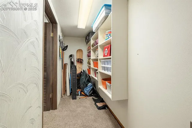 a view of a livingroom with the entryway