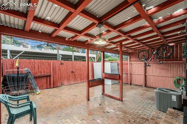 a view of a room with wooden walls