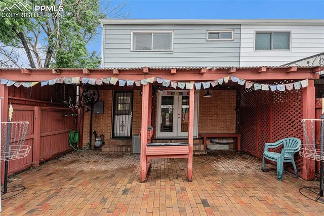 a view of a cafe with a table and chairs and wooden floor
