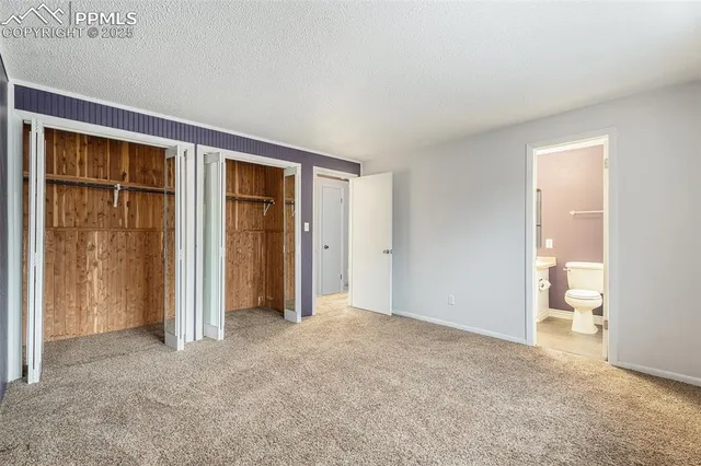 an empty room with closet area