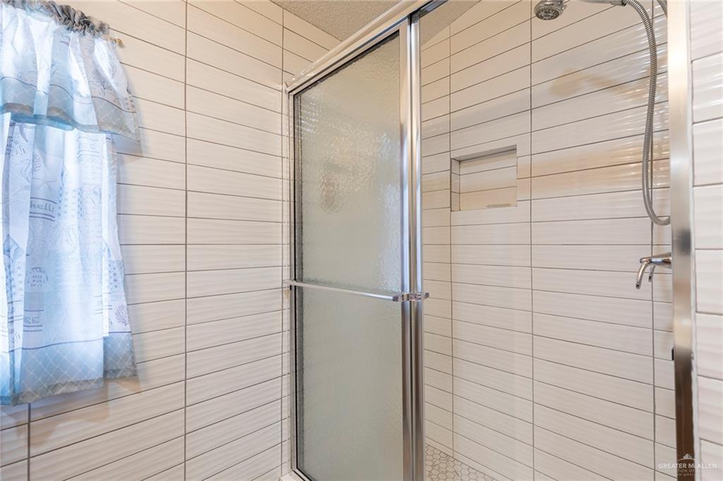 405 Cory Drive Mission, TX 78572 - Photo 11 of 13 a bathroom with a shower