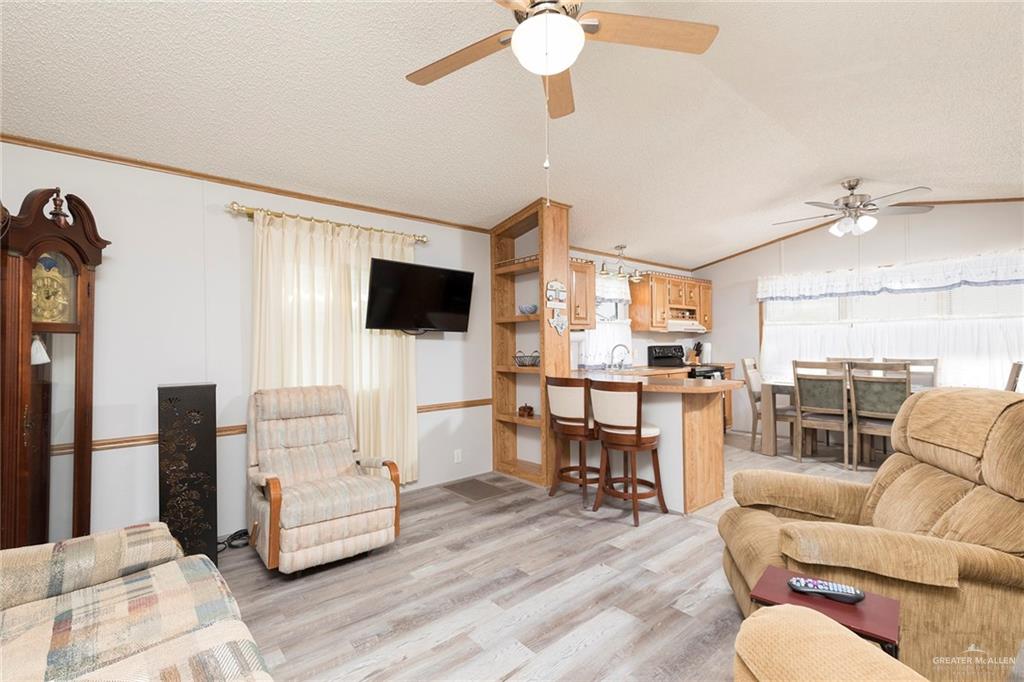 405 Cory Drive Mission, TX 78572 - Photo 4 of 13 a living room with furniture and a flat screen tv