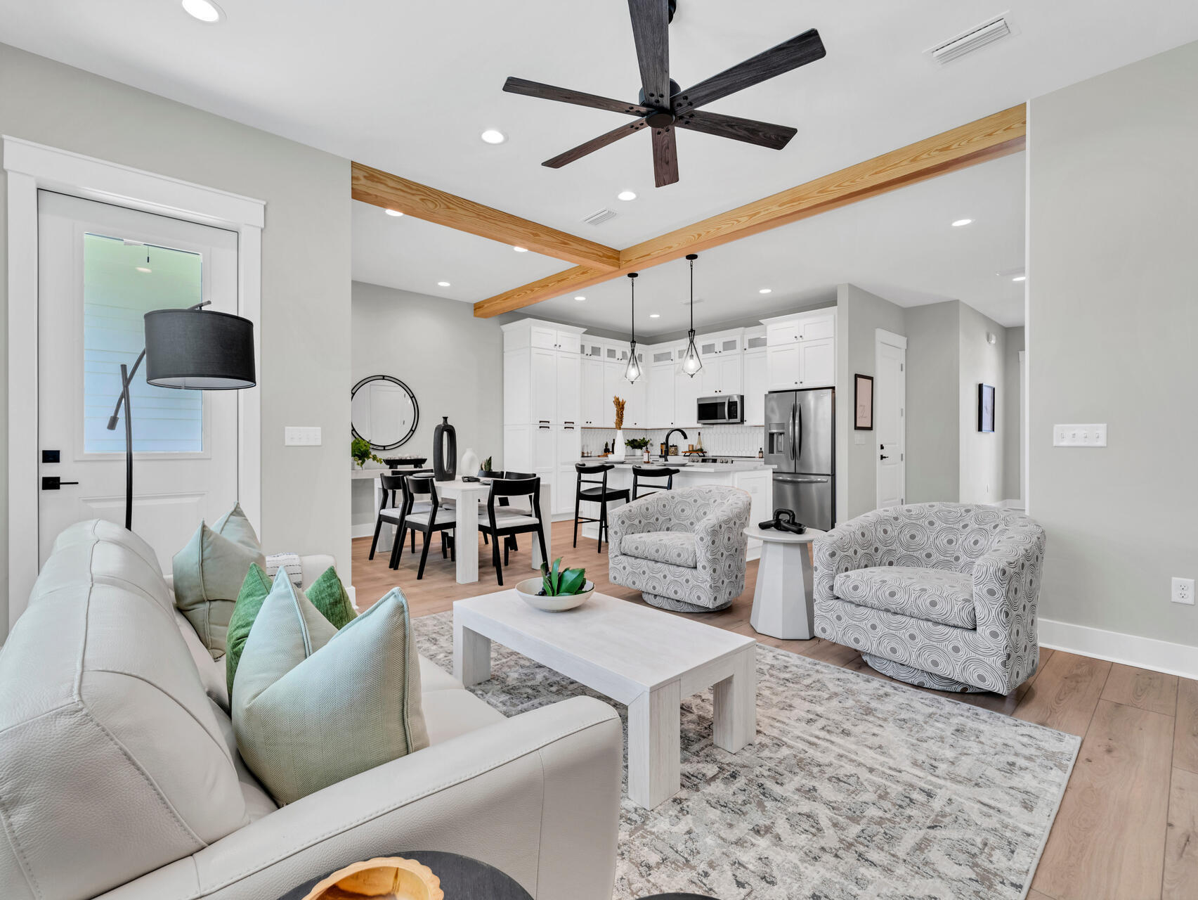 140 Sibert Avenue, Unit 7 Destin, FL 32541 - Photo 11 of 38 a living room with furniture kitchen view and a chandelier