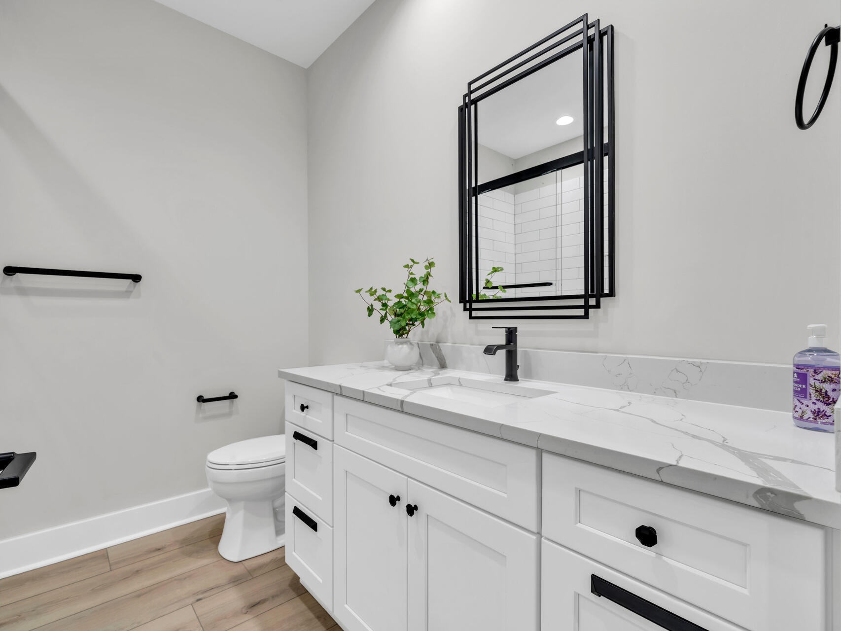140 Sibert Avenue, Unit 7 Destin, FL 32541 - Photo 23 of 38 a bathroom with a granite countertop toilet sink and mirror