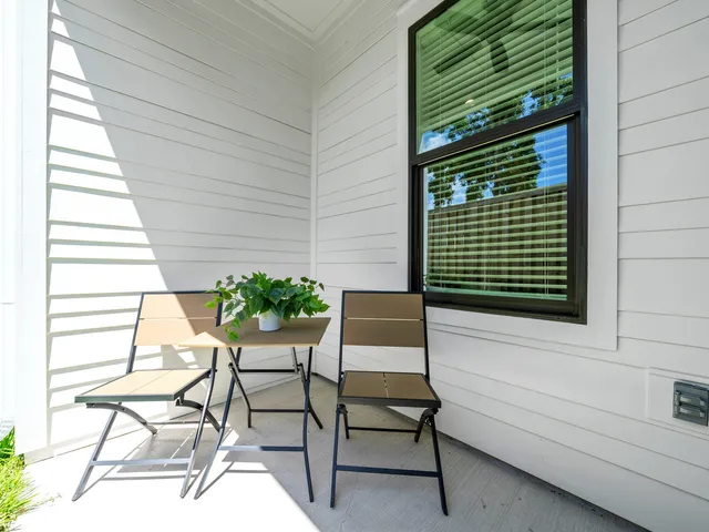 a view of backyard with a garden and trees