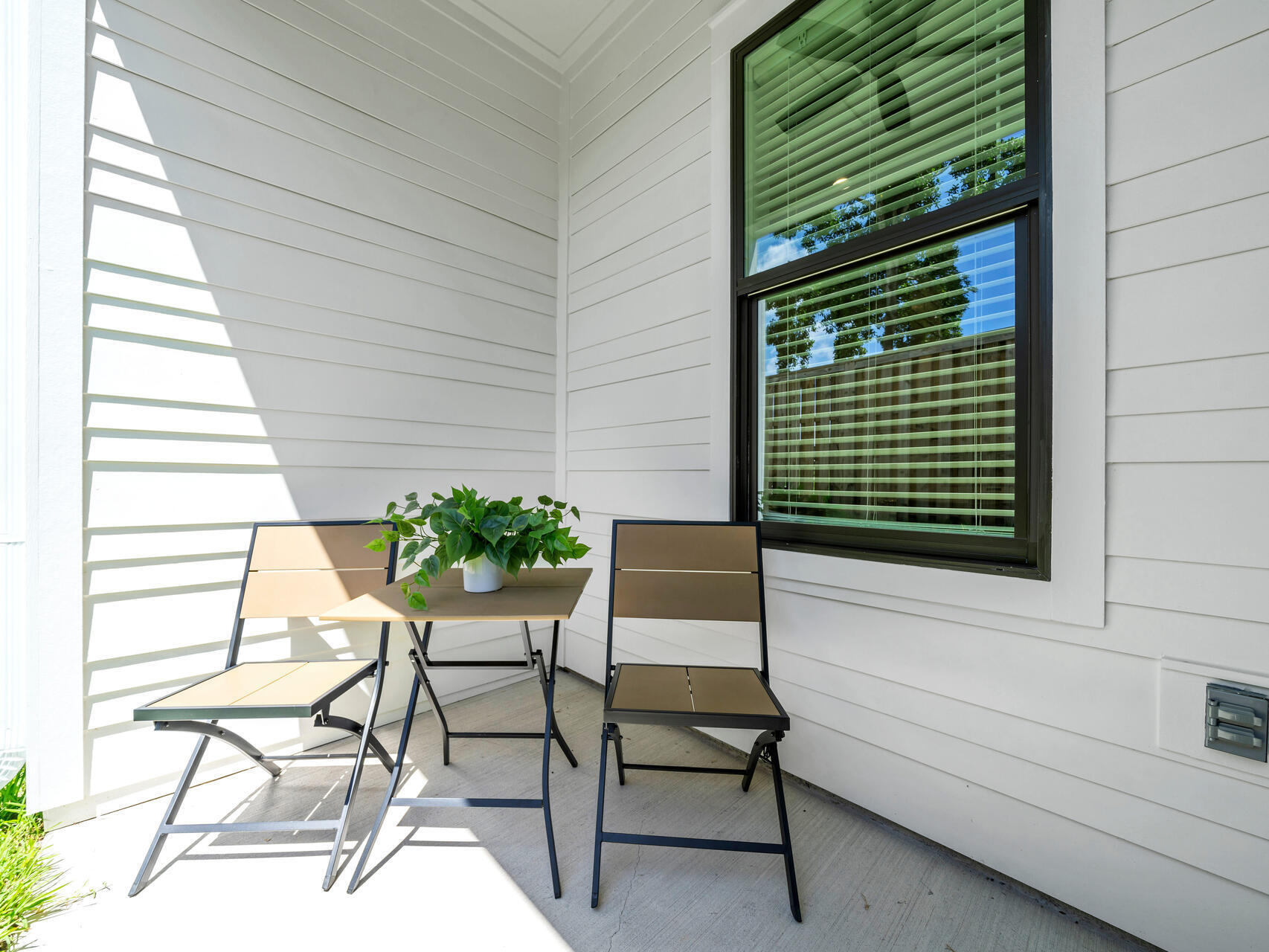 140 Sibert Avenue, Unit 7 Destin, FL 32541 - Photo 25 of 38 a view of a chairs and table in a balcony
