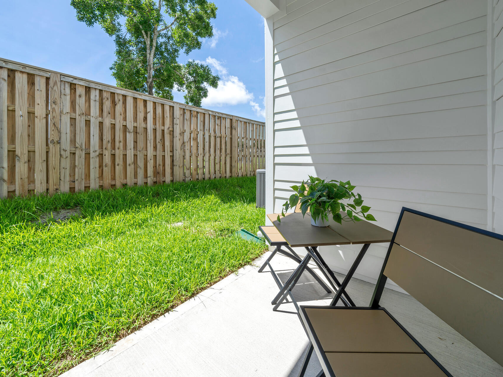 140 Sibert Avenue, Unit 7 Destin, FL 32541 - Photo 26 of 38 a view of backyard with a garden and trees