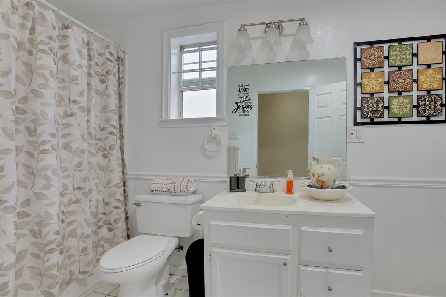 1408 Hazel Street Gridley, CA 95948 - Photo 26 of 60 a bathroom with a sink a toilet and a mirror