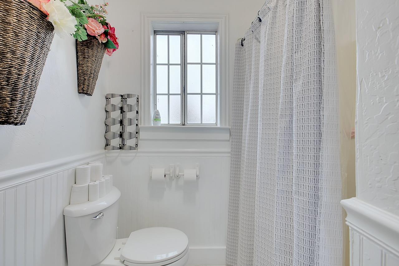 1408 Hazel Street Gridley, CA 95948 - Photo 29 of 60 a white toilet sitting next to a bathroom sink