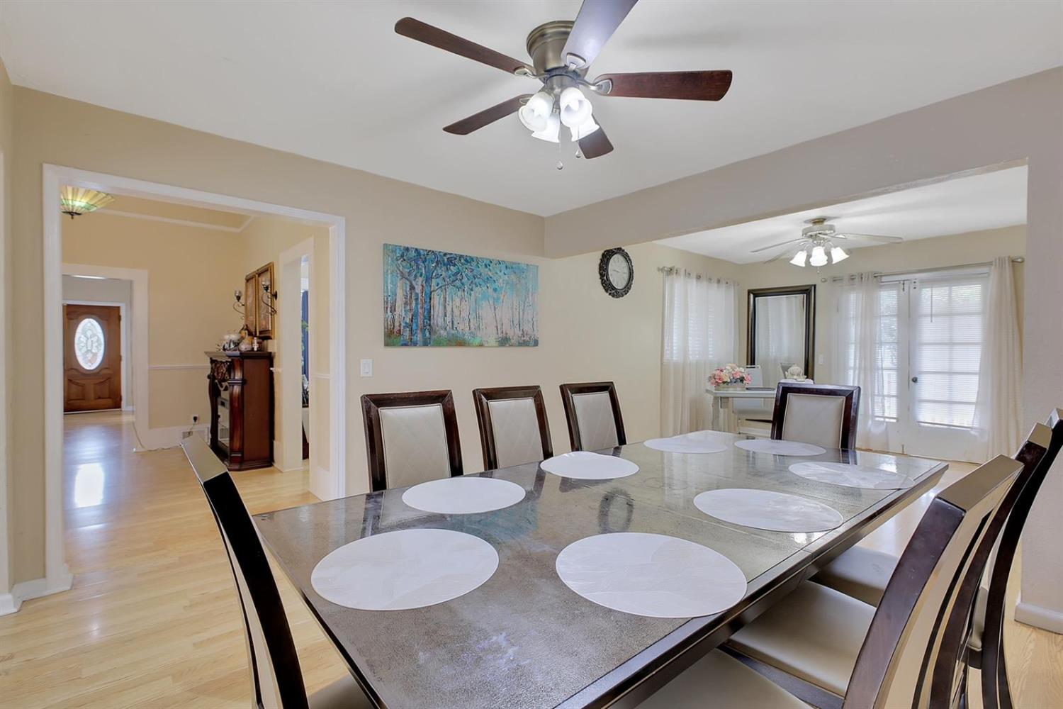 1408 Hazel Street Gridley, CA 95948 - Photo 51 of 60 a view of a dining room with furniture and a chandelier
