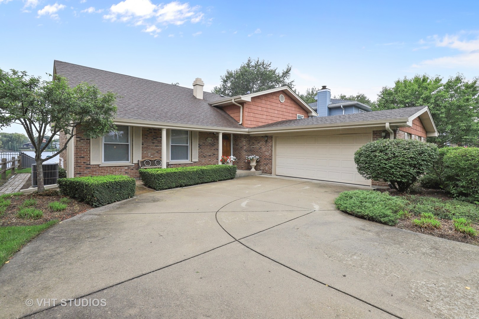 404 Beck Road Lindenhurst, IL 60046 - Photo 1 of 15 a front view of a house with a yard and a garage