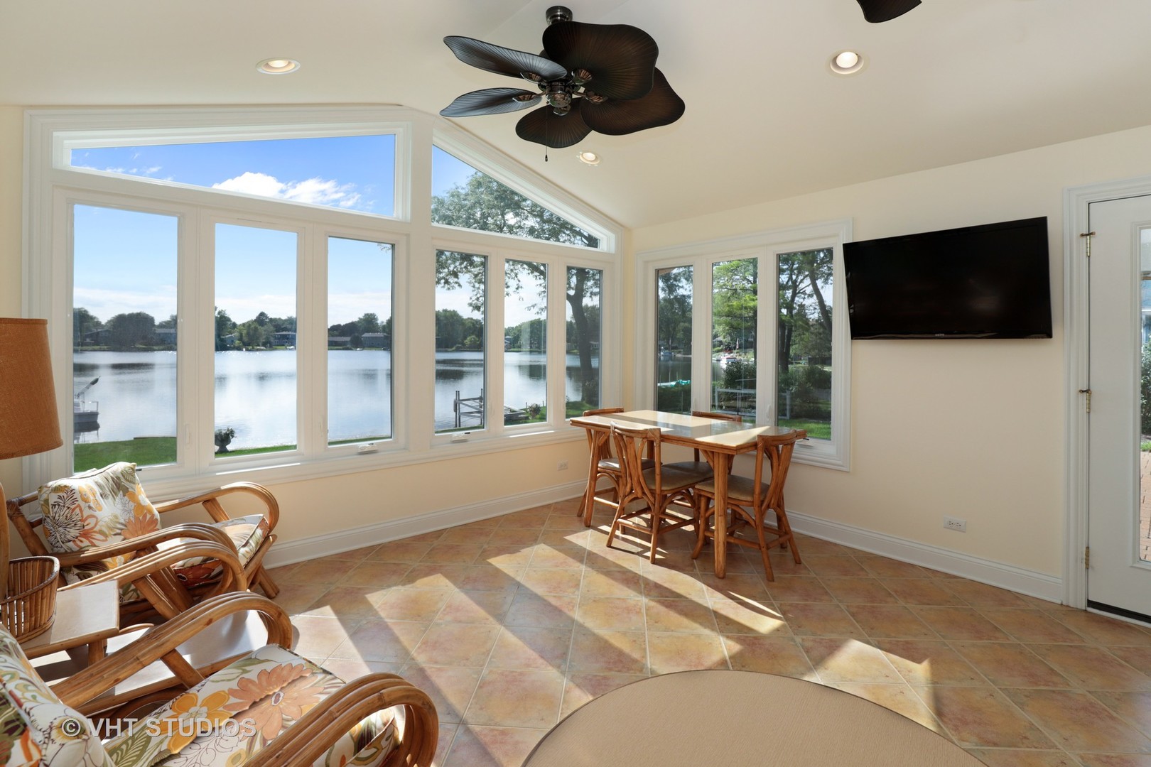 404 Beck Road Lindenhurst, IL 60046 - Photo 2 of 15 a living room with furniture a flat screen tv and windows