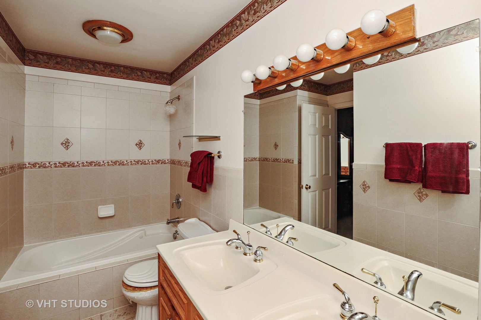 404 Beck Road Lindenhurst, IL 60046 - Photo 11 of 15 a bathroom with a sink a toilet and shower