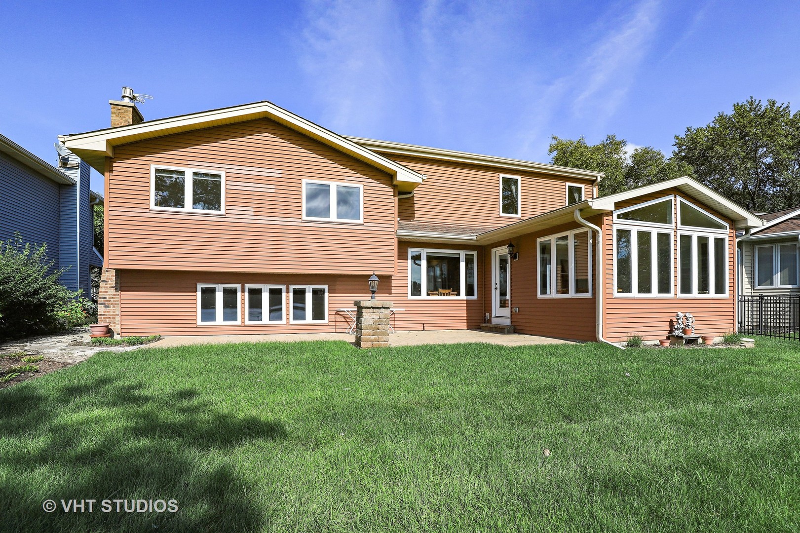 404 Beck Road Lindenhurst, IL 60046 - Photo 14 of 15 a front view of a house with a yard and porch