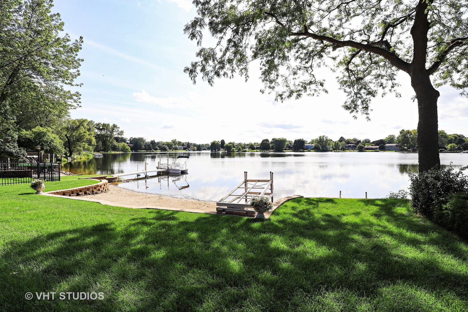 404 Beck Road Lindenhurst, IL 60046 - Photo 3 of 15 a swimming pool with outdoor seating and garden