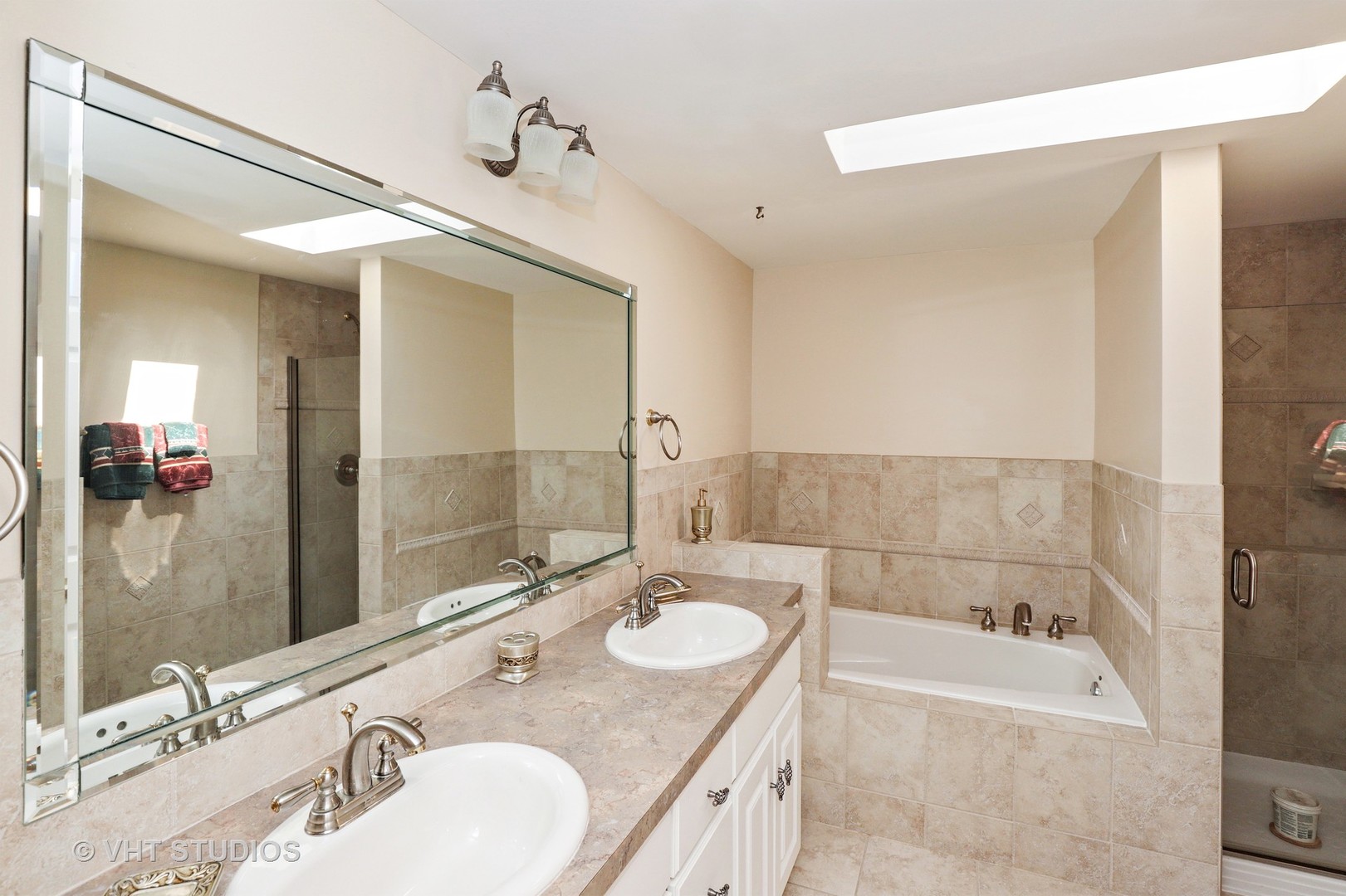 404 Beck Road Lindenhurst, IL 60046 - Photo 7 of 15 a bathroom with a granite countertop tub sink and mirror