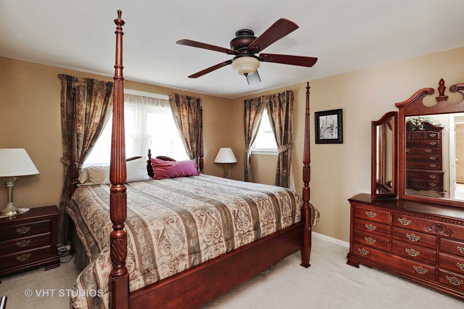 404 Beck Road Lindenhurst, IL 60046 - Photo 9 of 15 a bedroom with a bed a dresser and a window