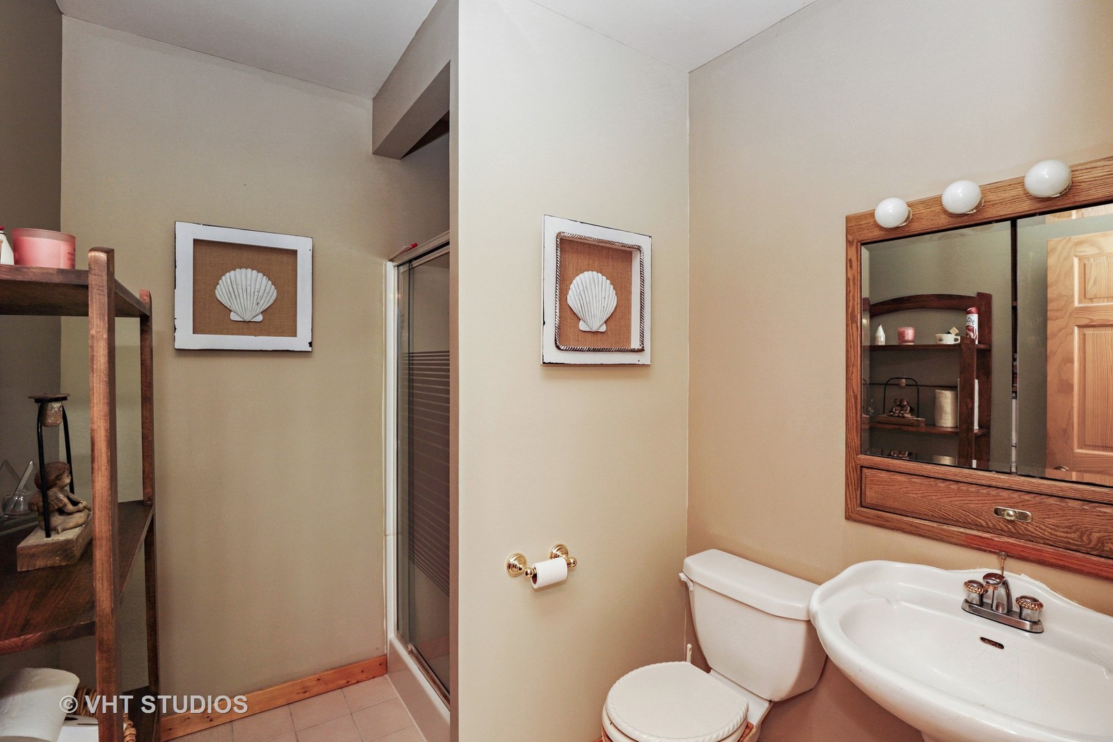 404 Beck Road Lindenhurst, IL 60046 - Photo 10 of 15 a bathroom with a toilet sink and mirror