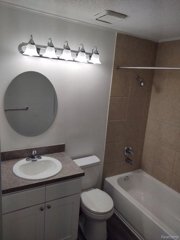 35775 Union Lake Road Clinton Township, MI 48035 - Photo 24 of 30 Full bath with a textured ceiling, shower / bath combination, vanity, and wood finished floors