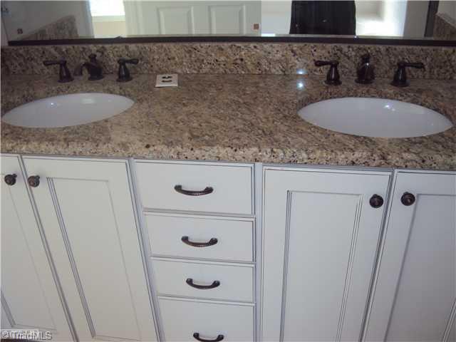 5059 Peppertree Road Clemmons, NC 27012 - Photo 11 of 16 Master Bath/Spa. Beautiful Cabinets and Granite in the Master Bath!