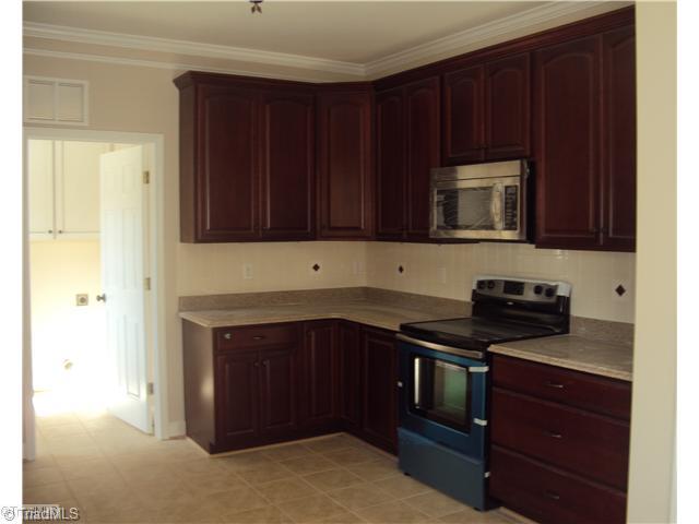 5059 Peppertree Road Clemmons, NC 27012 - Photo 4 of 16 Kitchen. Granite counters and tile floors complete this desireable kitchen!